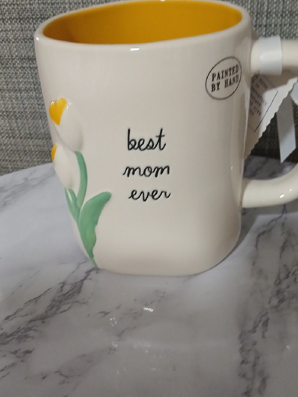 Rae Dunn Cream Ceramic Mug with Yellow Interior and Floral Accent